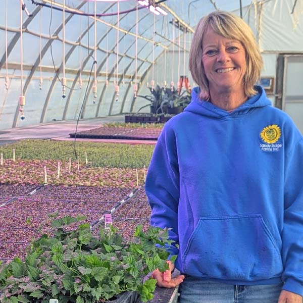 Julie Kane, hop grower at Sandy Ridge Farms. Photo credit: Sarah McKenney, Sandy Ridge Farms